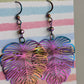 Lightweight rainbow Monstera dangling earrings, rainbow anodized stainless steel. Handcrafted by Cappa Creations, made of stainless steel, making them the highest quality, waterproof, tarnish proof, hypoallergenic, and nickel free! 

Perfect to wear on a beautiful summer day or  the sweetest gift for any plant lover! 