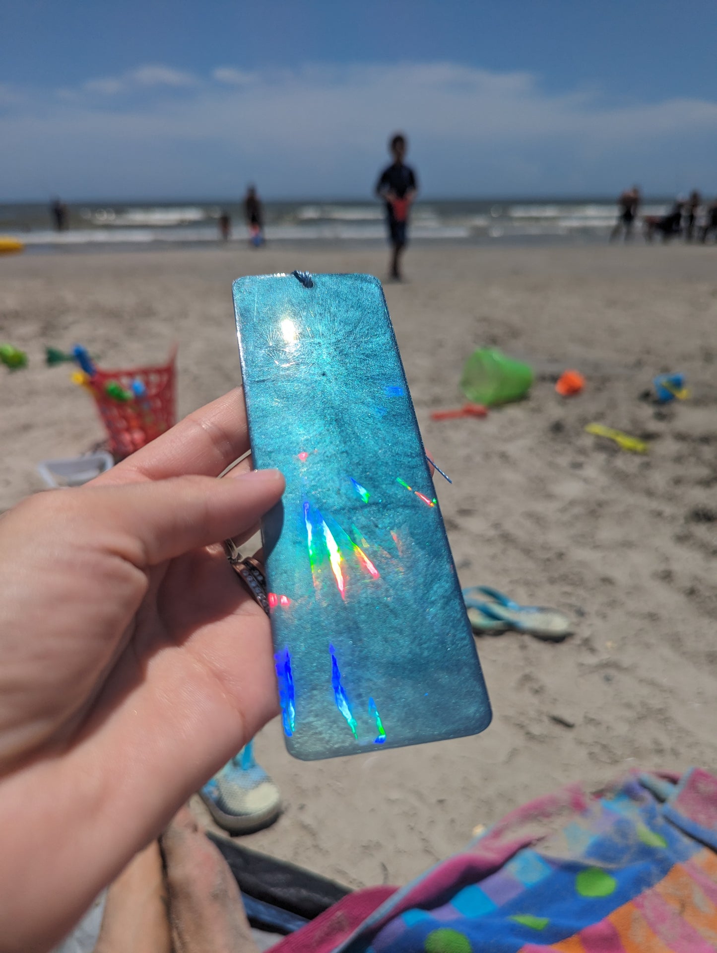 Cappa Creations Ocean Lover Bookmark | Beach Lover Gift | Bookmark | Book Lover Gift | Avid Reader | Book Club Gift | Valentines Day | Teacher Gift handmade large holographic resin bookmark, rainbow prisms, ocean resin bookmarks with real beach sand, enjoyment for booklovers, bookworm, color shift and glitter sparkles