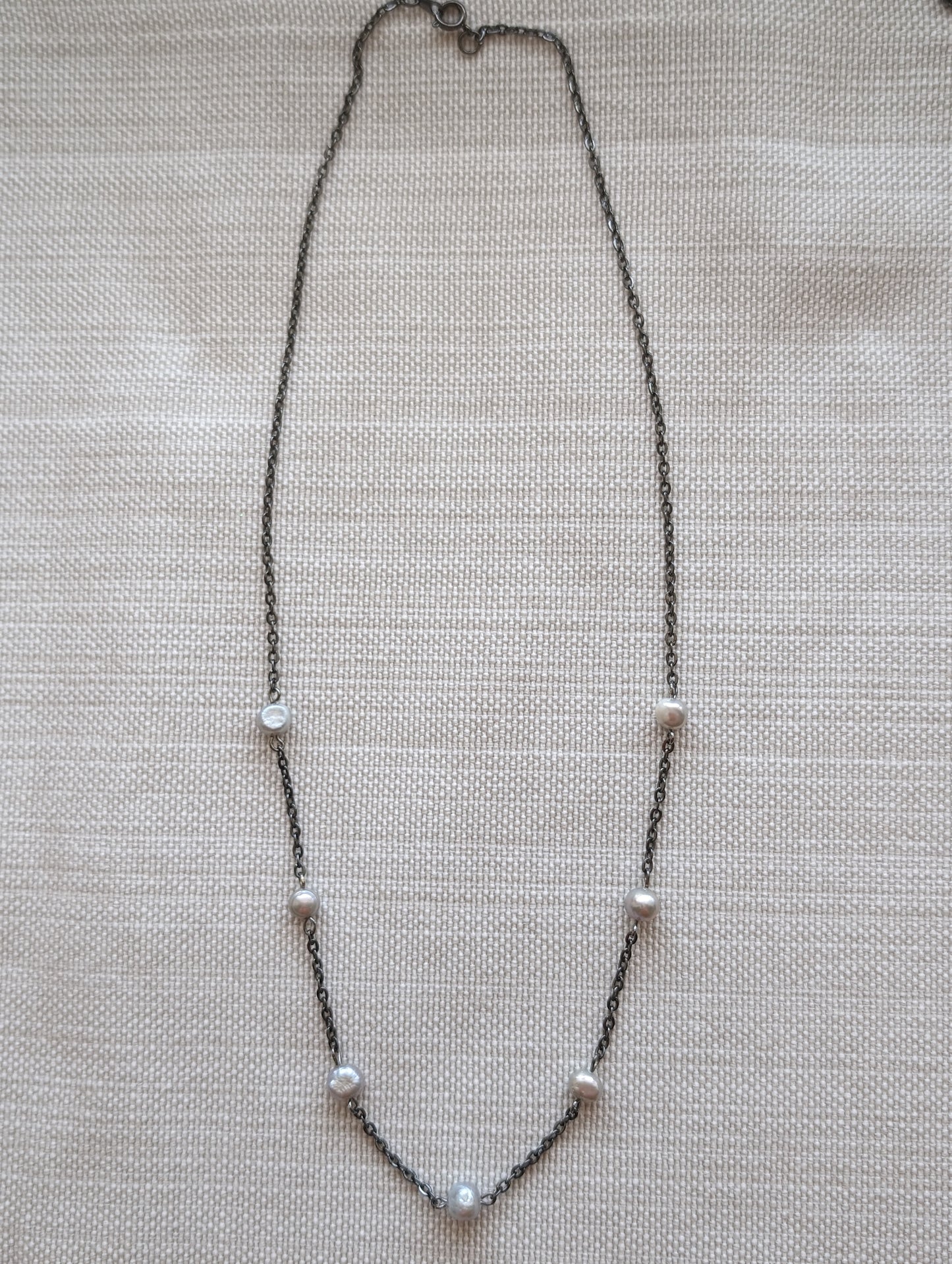 Elevate your style with our Dainty Lavender Pearl Necklace! This elegant piece features delicate lavender grey pearls on a sleek gunmetal chain. Perfect for any occasion, this necklace adds a touch of sophistication to any outfit. Upgrade your jewelry collection today! layered bohemian necklaces by cappa creations, tropical beachy jewelry, freshwater pearls, layered necklaces