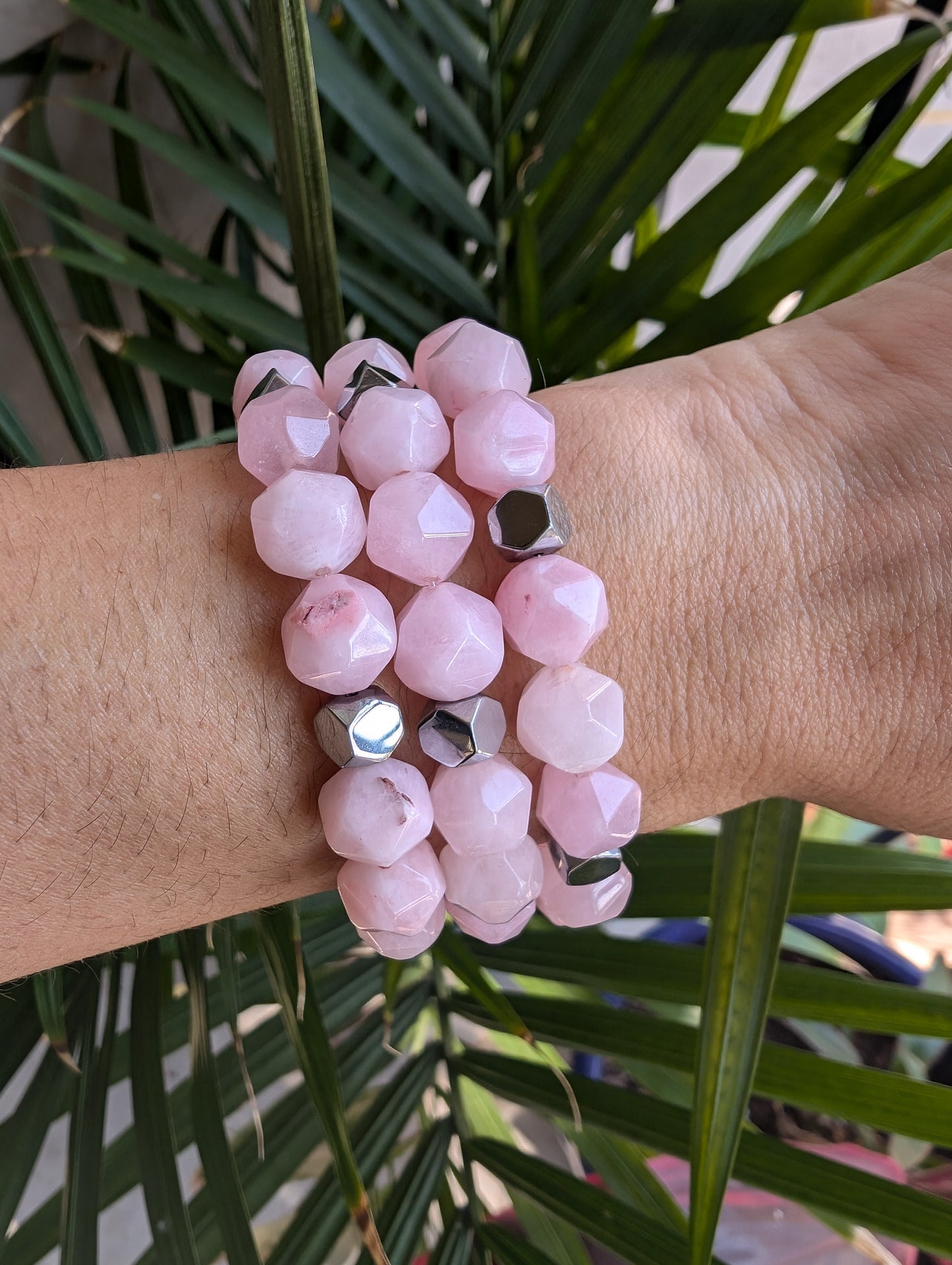 Breast Cancer Awareness bracelet with rose quartz and silver hematite beads symbolizing healing, strength, and love.