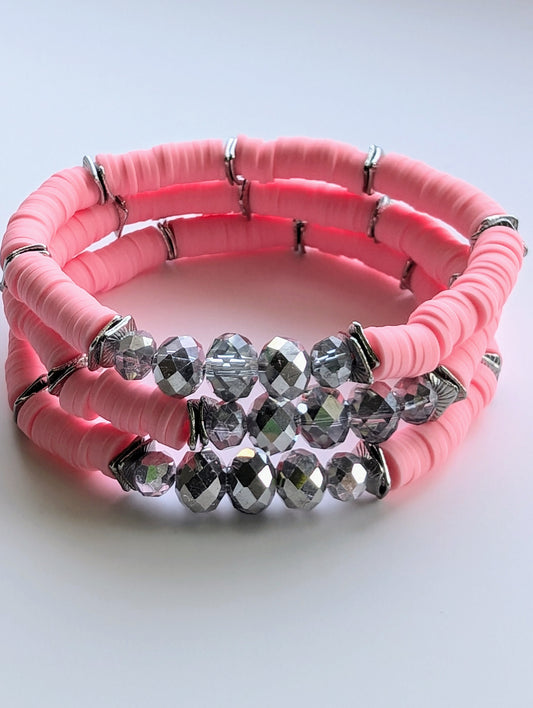 Breast Cancer Boho Heishi Stretchy Bracelet in pink and silver, handmade for breast cancer awareness, symbolizing hope and strength.