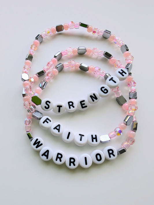 Breast Cancer Pink Good Vibes Stretchy Bracelet featuring pink beads and affirmation charms, symbolizing love, honor, and encouragement for survivors and fighters.