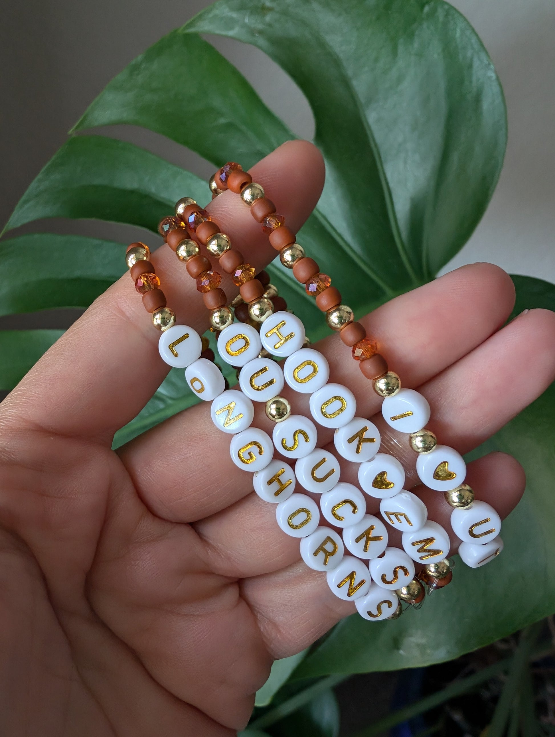 Texas Vibes stretchy gold hematite bracelet featuring Czech glass seed beads and faceted crystal glass beads, perfect for game day team spirit and stacking