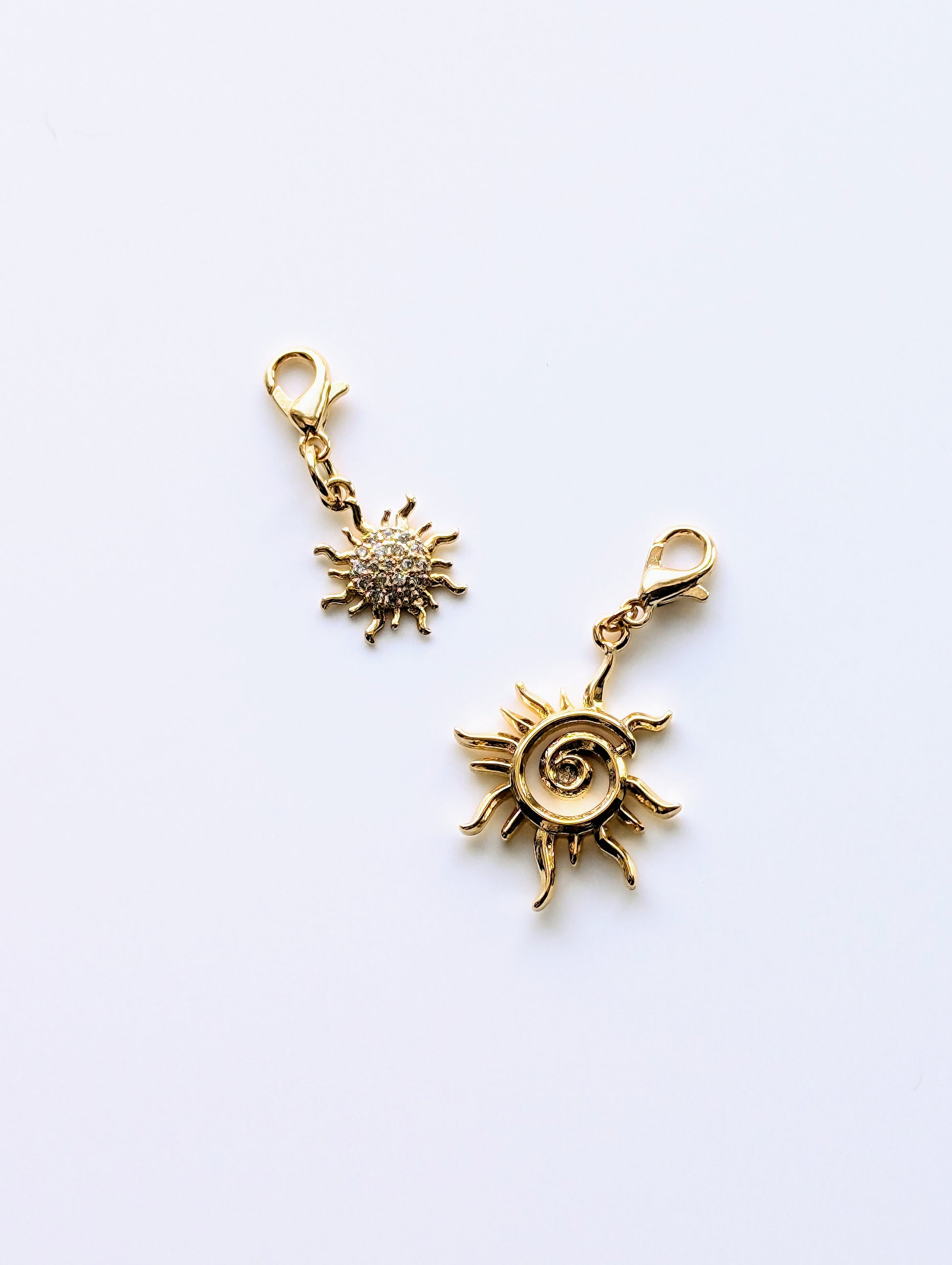 18K Gold Plated Sun charms with lobster claw clasp for adjustable placement. Available in 2 variations; with or without stones.