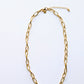 24k gold oval paperclip chain necklace with 6x12 mm links, displayed on a clean white background.