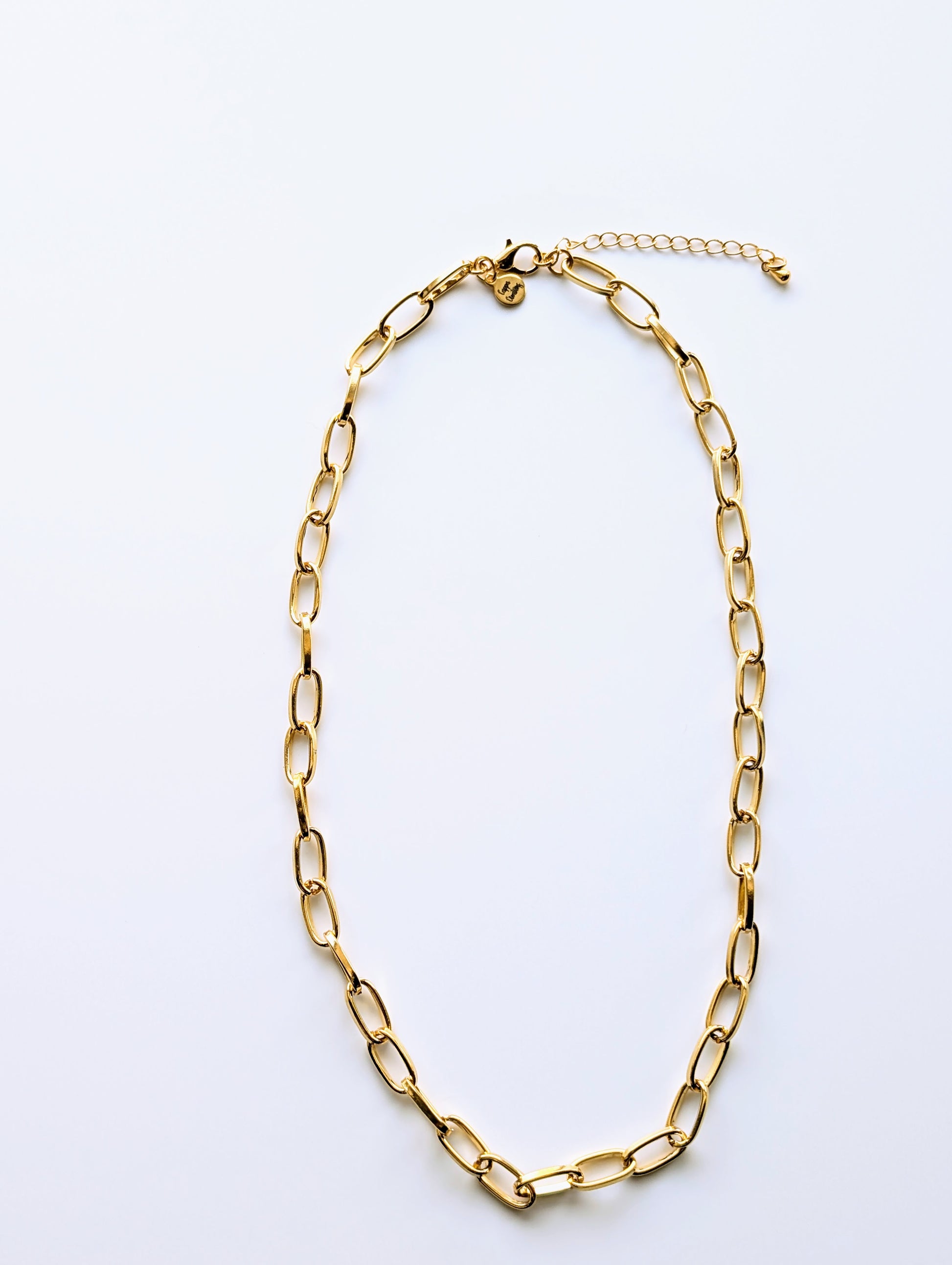 24k gold oval paperclip chain necklace with 6x12 mm links, displayed on a clean white background.