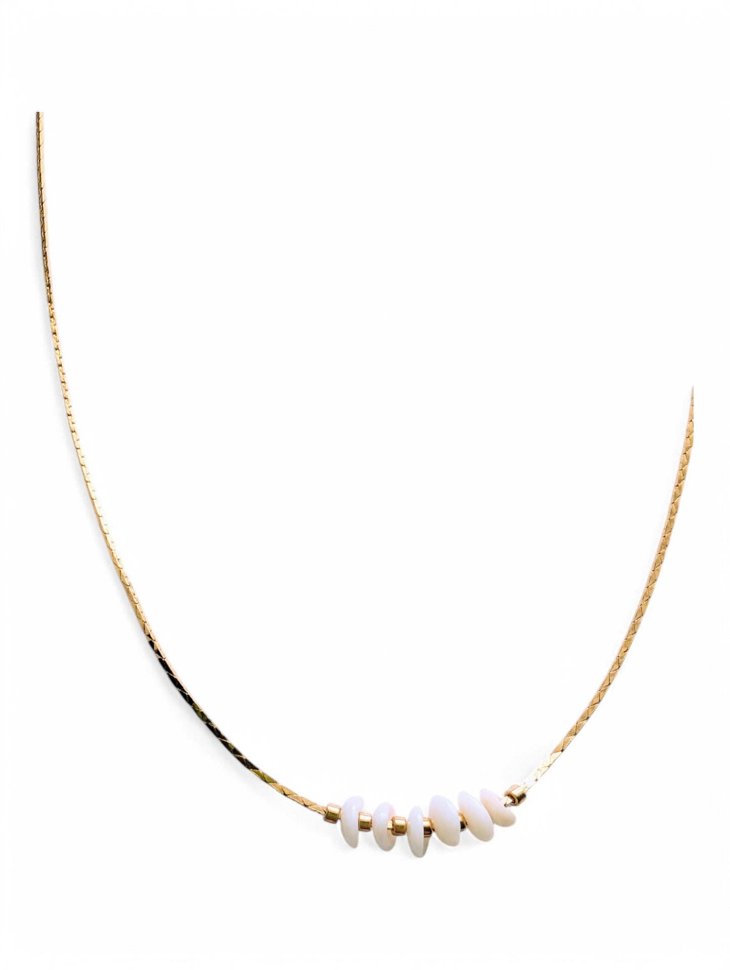 24K gold-plated snake chain with Puka shells for good luck and prosperity.&nbsp;
16 inches, ideal for layering or wearing solo.