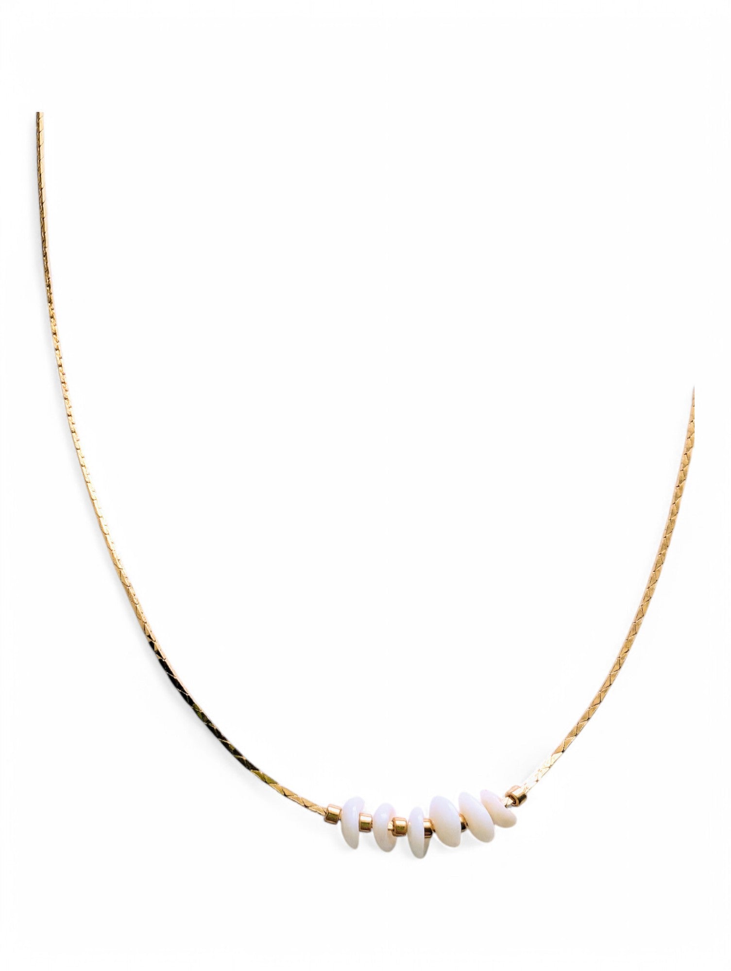 24K gold-plated snake chain with Puka shells for good luck and prosperity.&nbsp;
16 inches, ideal for layering or wearing solo.