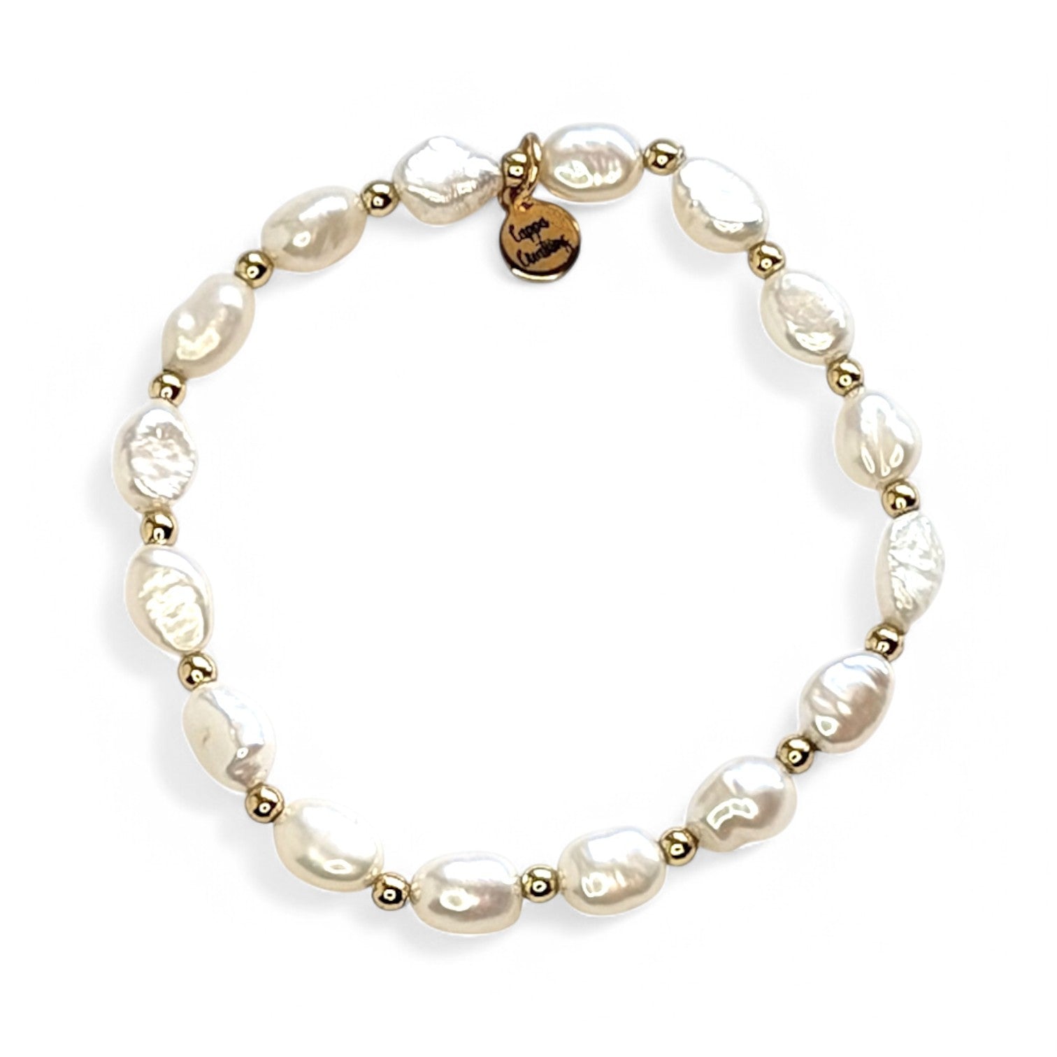 Versatile Pearl Bracelet styled alone and stacked with other gold bracelets for a chic, layered look by cappa creations.