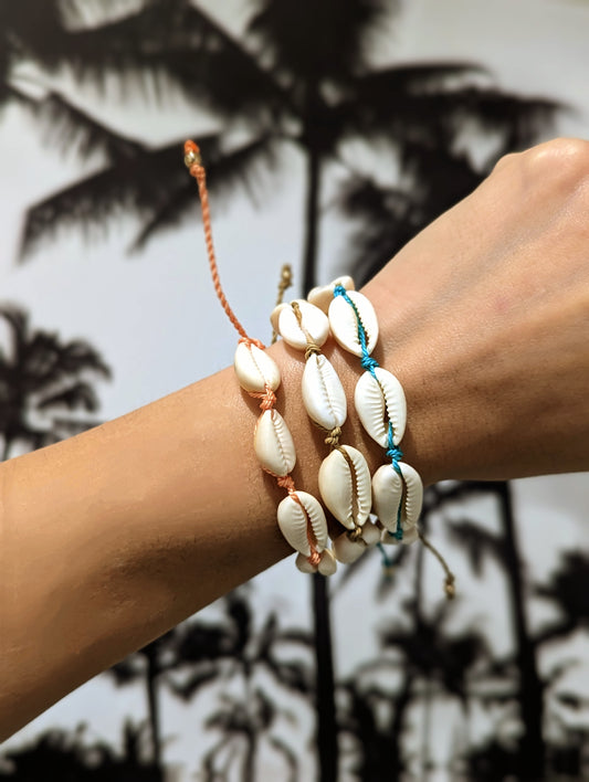 Cappa Creations Tropical bohemian jewelry inspired by the ocean and made with aloha, Cowrie shell macramé bracelet with adjustable locking closure and available in many colors. 